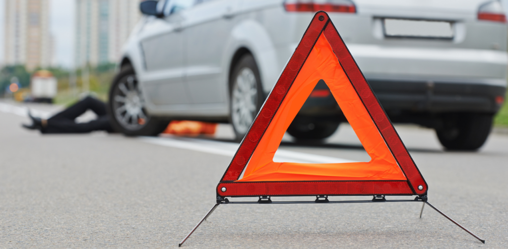 Red triangle behind a car and a pedestrian got hit but the same car