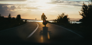 Motorcyclist Riding at Sunset
