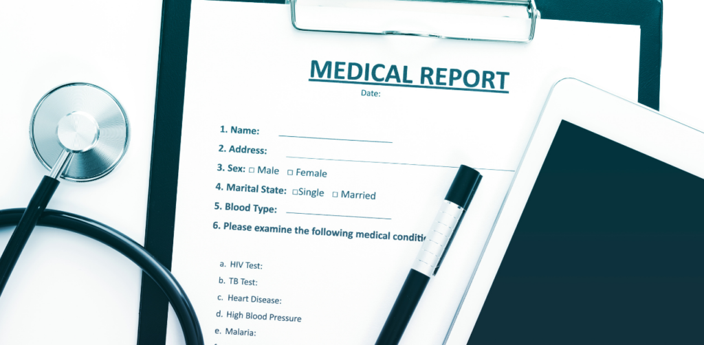 Medical report form on clipboard with pen, stethoscope, and tablet, ready for health documentation