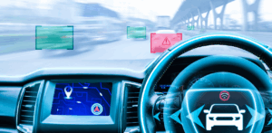 A smart car dashboard shows navigation and warning alerts using augmented reality while driving